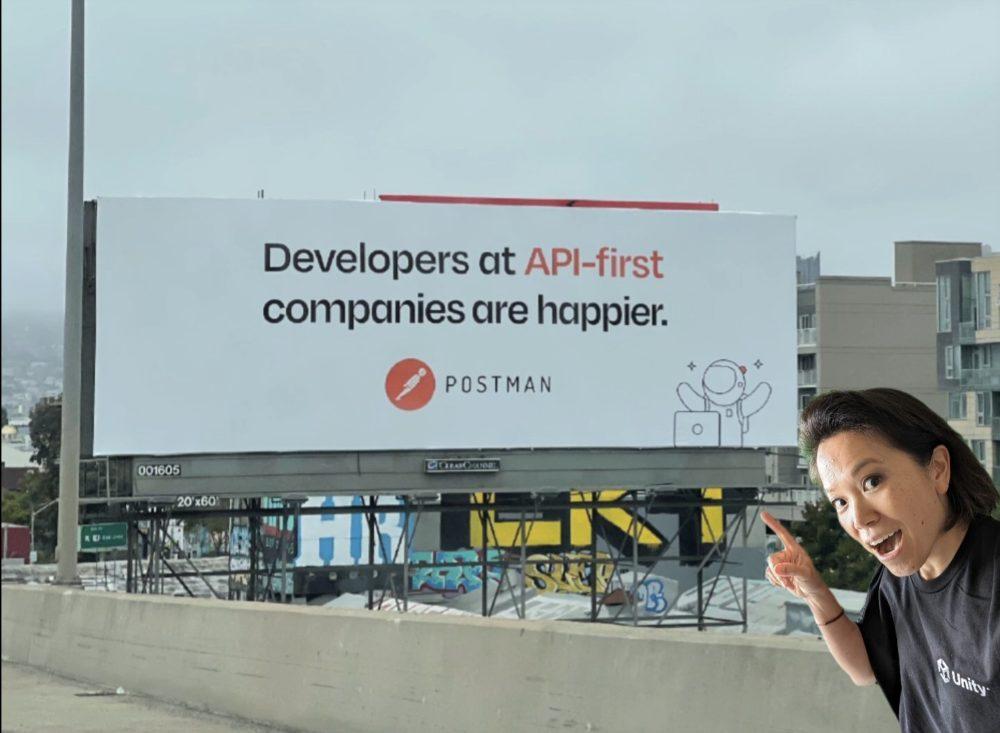 Postman billboard saying “Developers at API-first companies are happier”